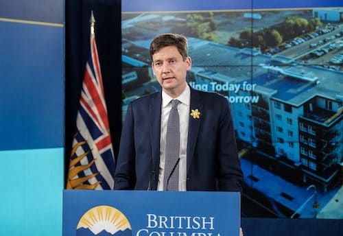 Man standing behind BC Government podium